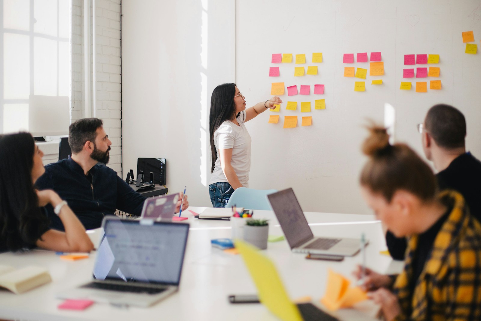 PropMotion AI team standup reviewing market analytics methodology and model validation